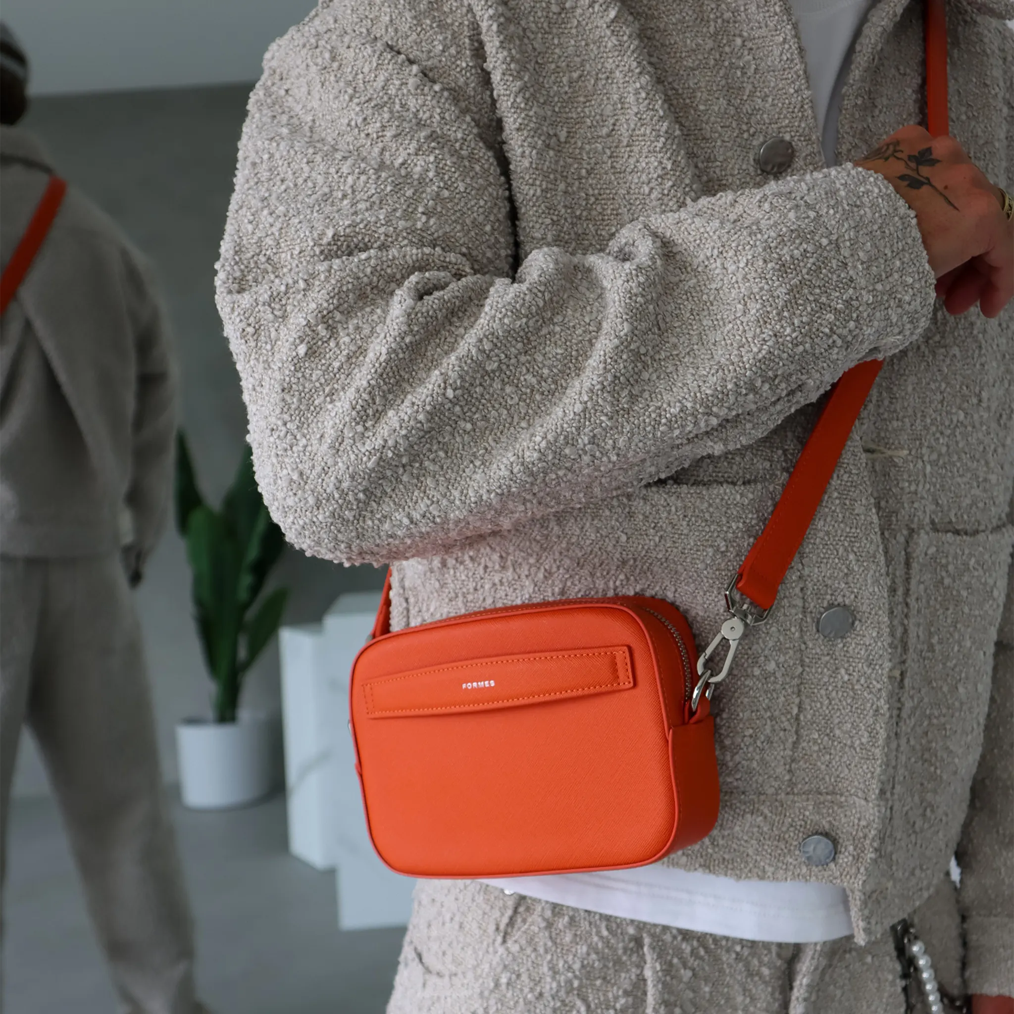 Front Model Side View of Formes Adapt Magna Mini Crossbody Bag